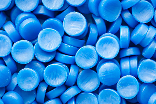 istock Blue plastic grain, plastic polymer granules,hand hold Polymer pellets, Raw materials for making water pipes, Plastics from petrochemicals and compound extrusion, resin from plant polyethylene. 1265193880