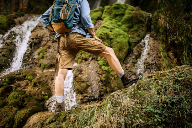 istock Senior hiker enjoying his waterfall view 1265195068