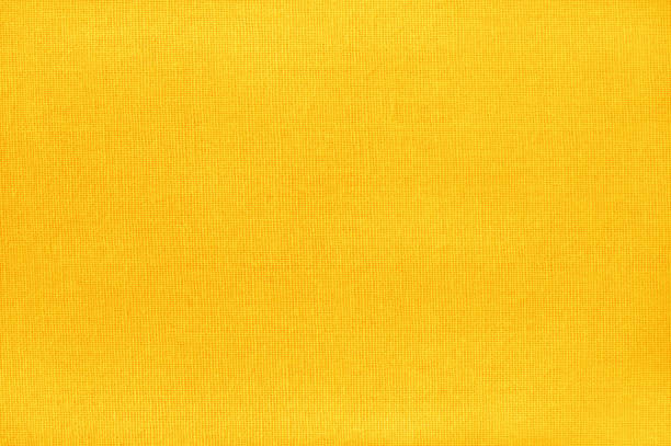 Yellow cotton fabric texture background, seamless pattern of natural textile. Yellow cotton fabric texture background, seamless pattern of natural textile. flax weaving stock pictures, royalty-free photos & images