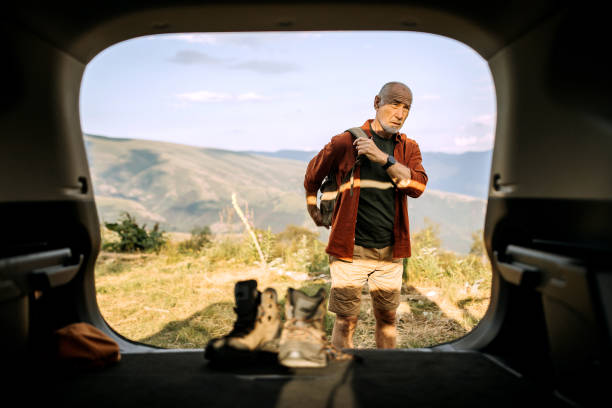 istock Senior hiker getting ready for hiking 1265195186