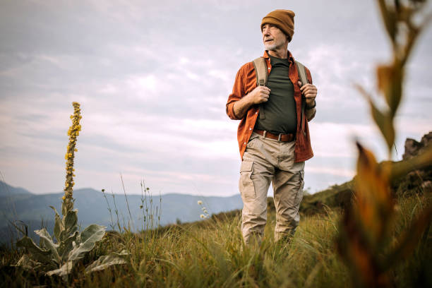 istock Senior hiker enjoying his view at countryside 1265195395