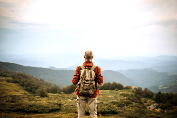 Senior hiker looking at beautiful landscape