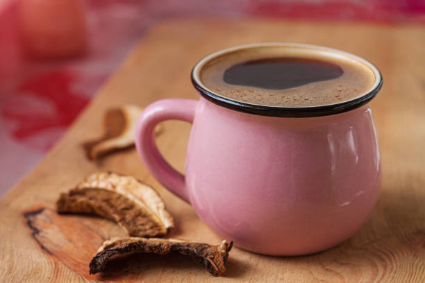 mushroom coffee chaga superfood. dried mushrooms and fresh brewed cup of hot drink on wooden background. food trends - shiitake mushroom edible mushroom mushroom dry imagens e fotografias de stock