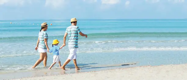 Happy family summer sea  beach vacation. Asia young people lifestyle travel enjoy fun and relax in holiday. Travel and Family Concept