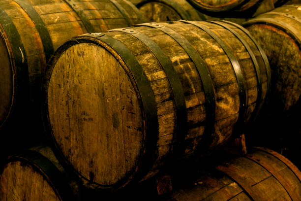 istock Wine barrels stacked in the old cellar of the winery. 1265200547