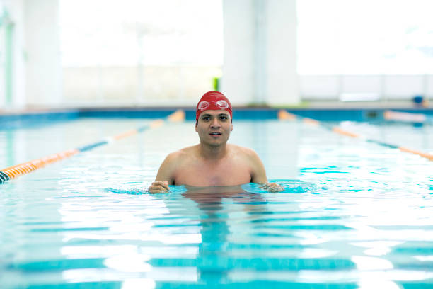 Young athletic man with butterfly swimming technique