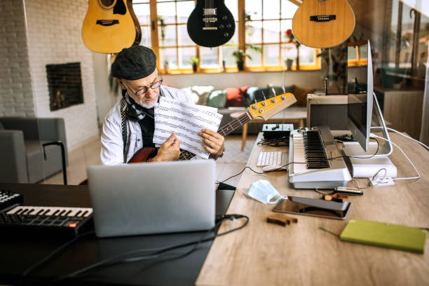istock Senior music teacher giving online music classes during lock down 1265201625