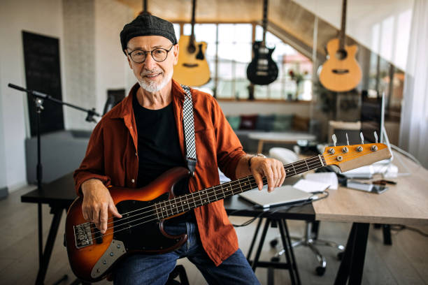 istock Senior musician posing in his studio office 1265201634