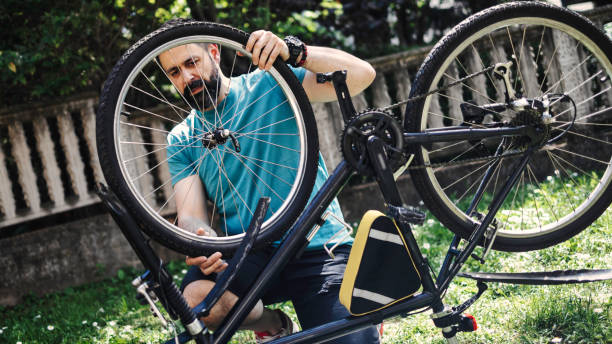 istock Man repairing bicycle DIY 1265201658