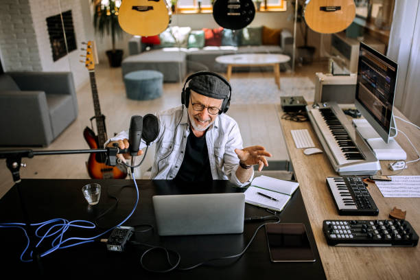 istock Senior radio host feeling energized in his home office studio 1265201852