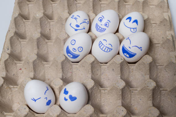 istock Funny chicken eggs. Smiley eggs with faces, funny faces. Eggs with different emotions: laughter, smiles, fear, anger, scream, tears. 1265202230