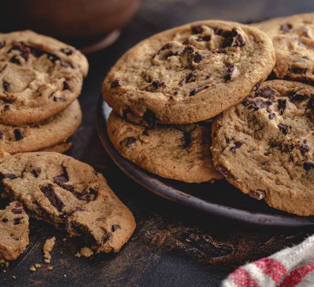 istock Chocolate Chip Cookies on a Wooden Table 1265202996
