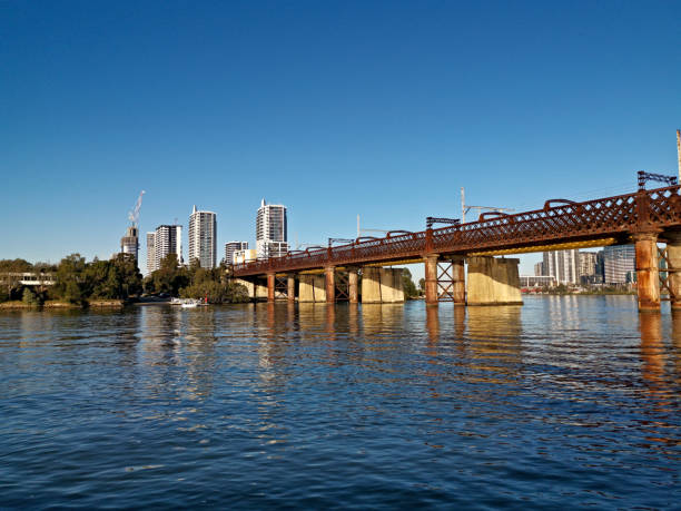 istock Beautiful view of a railway bridge over a river on a sunny day with deep blue sky 1265203002