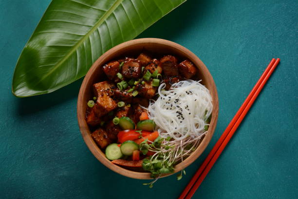 fried tofu with rice crystal noodles in a wooden bowl. - crystal noodles imagens e fotografias de stock