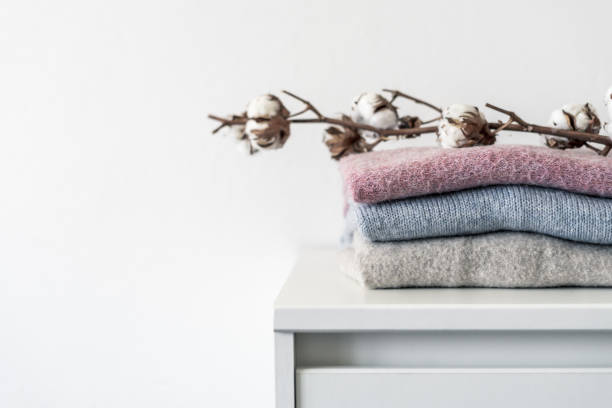 istock A stack of wool sweaters with dried cotton plant 1265204377