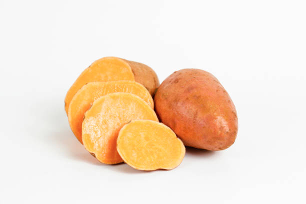 istock studio shot of orange sweet potatoes 1265204721