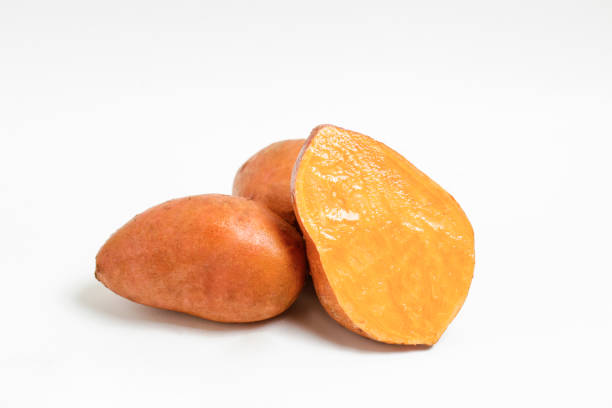 istock studio shot of orange sweet potatoes 1265204727