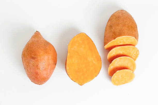 istock studio shot of orange sweet potatoes 1265204764