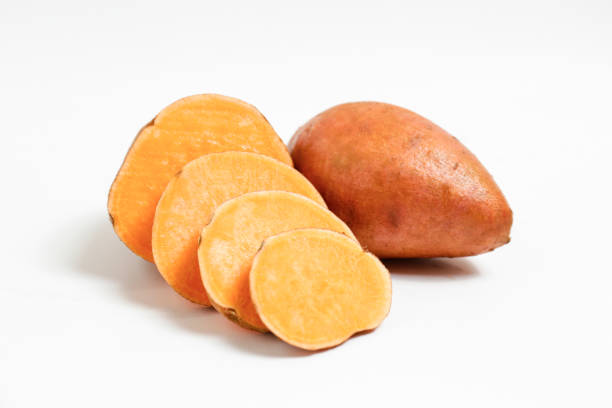 istock studio shot of orange sweet potatoes 1265204774