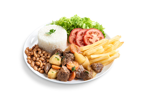 Executive dish minced meat with rice, beans, salad, french fries seen from below
