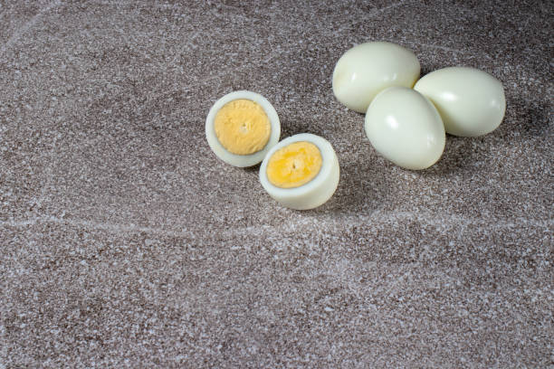 istock Boiled peeled eggs without shell on a gray background. Ingredients for cooking. 1265206118