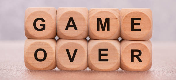 istock game over printed on wooden cubes 1265209117