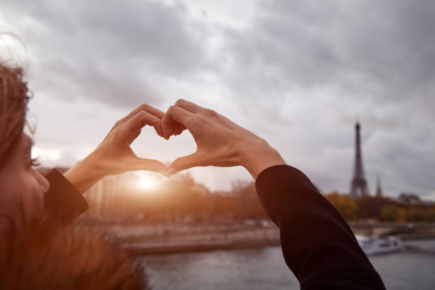 istock Girl using cellphone with Paris city background, Seine river and Eiffel tower. 1265210332