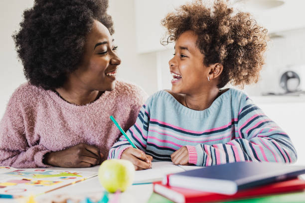 istock Young mother is learning with her daughter 1265211512