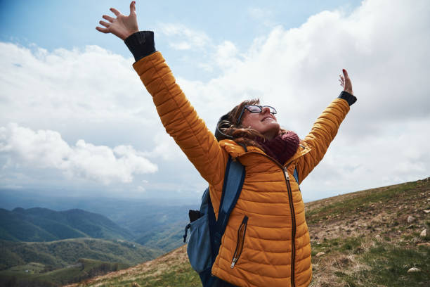 istock Woman enjoying on a mountain fresh air. 1265212122