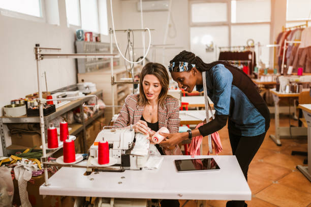 istock Dressmaker woman working with sewing machine 1265212907