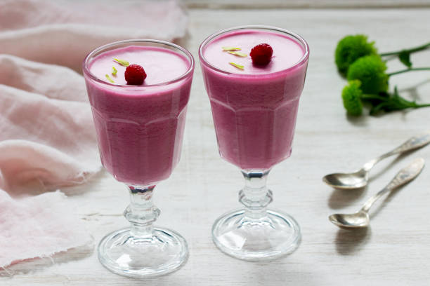 istock Berry-fruit mousse decorated with raspberries on a light background. 1265215165
