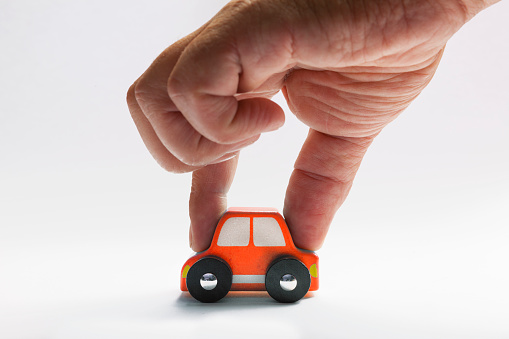 Human Hand and Toy Car
