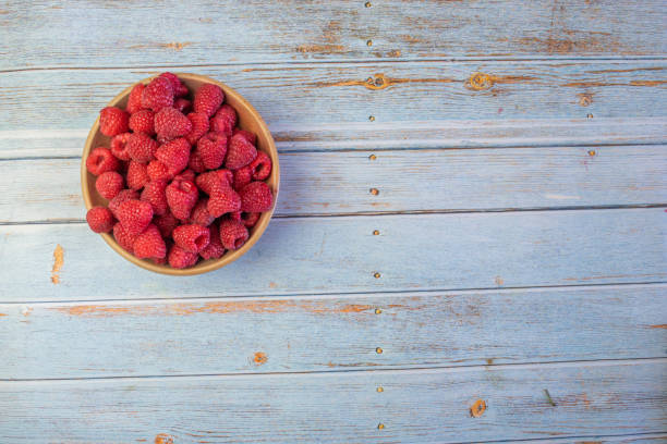 istock top view of fresh raspberries in rustic bowl 1265220729