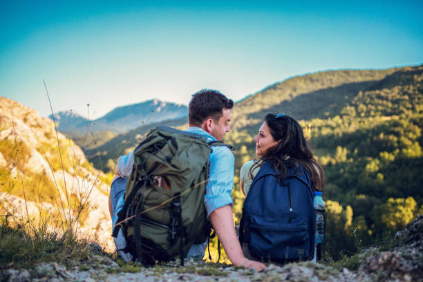 istock Couple hiking looking at view 1265221762