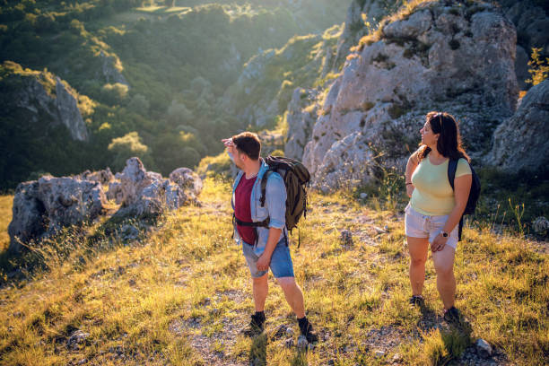 istock Backpackers hiking on the path in mountains 1265221953
