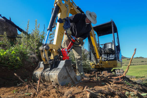 istock A man is busy building a new mountain bike track with is digger loader. 1265224355
