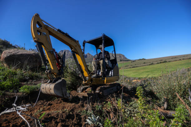 istock A man is busy building a new mountain bike track with is digger loader. 1265224511