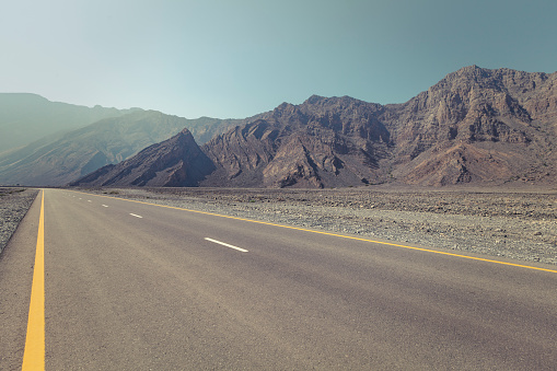 the road through the rocky mountain dessert of musandam peninsula in the sultanate of oman.