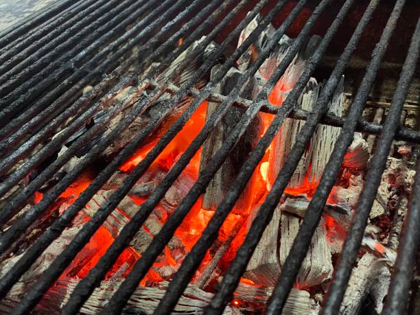 istock barbecue grill with charcoal and coal burning 1265227647