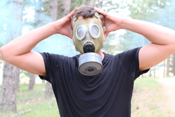 istock Man wearing rubber mask in toxic environment 1265229207