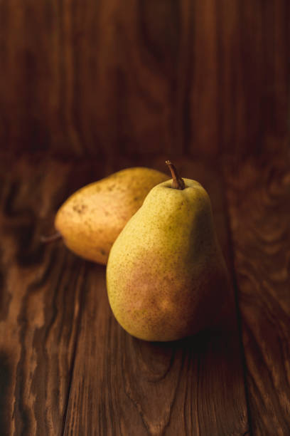 istock Pears on a wooden background 1265231755