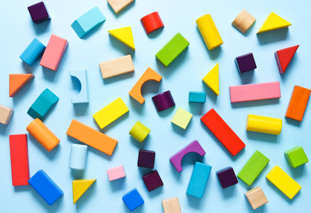 istock Wooden colorful cubes on a light blue background. View from above. Construction. 1265231761