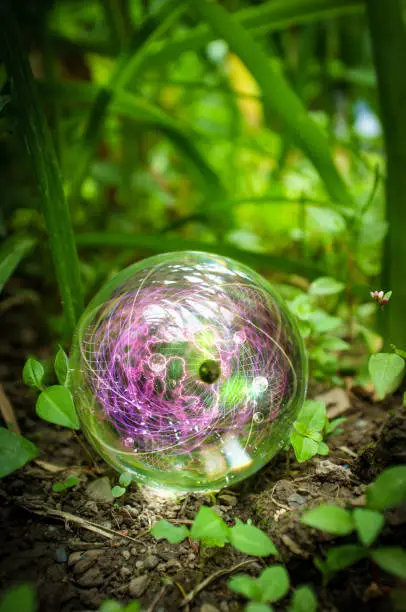 Magic crystal ball atom in nature for summer fantasy imagery