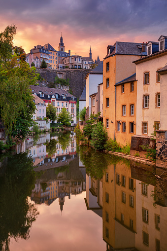 Cityscape image of old town Luxembourg skyline during beautiful summer sunset.