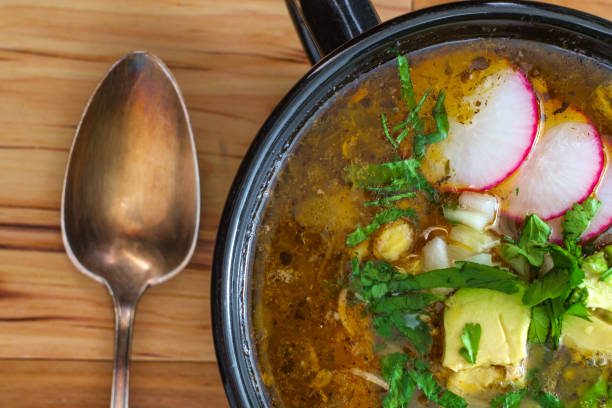 Mexican Pozole Soup Authentic Mexican pozole soup with avocado cilantro and radish garnish tomatillo photos stock pictures, royalty-free photos & images