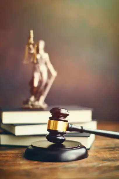 Photo of Gavel on desk with Lady Justice