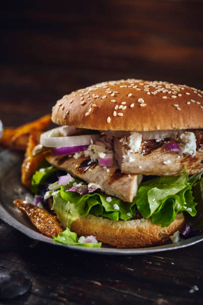 istock Grilled Chicken Burger with Feta Cheese, Onions and Lettuce 1265242548