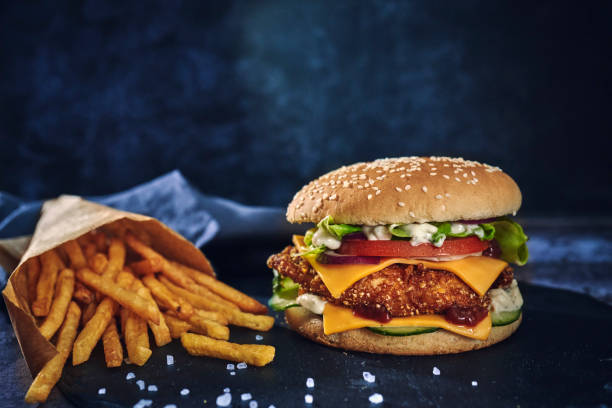 istock Crispy Chicken Burger with Cheese, Tomato, Onions and Lettuce 1265242726