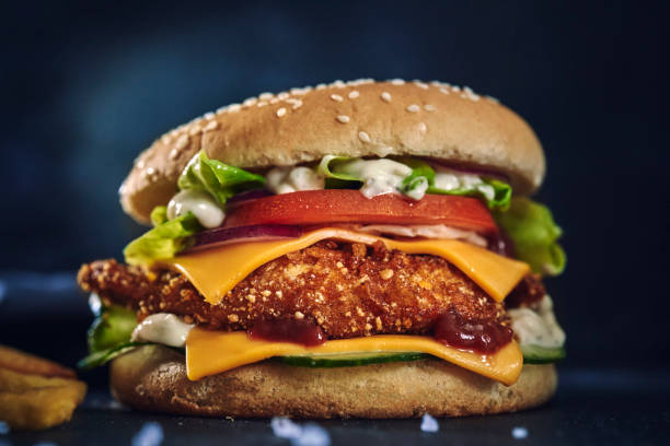 Crispy Chicken Burger with Cheese, Tomato, Onions and Lettuce