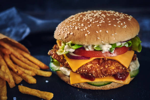 istock Crispy Chicken Burger with Cheese, Tomato, Onions and Lettuce 1265242741